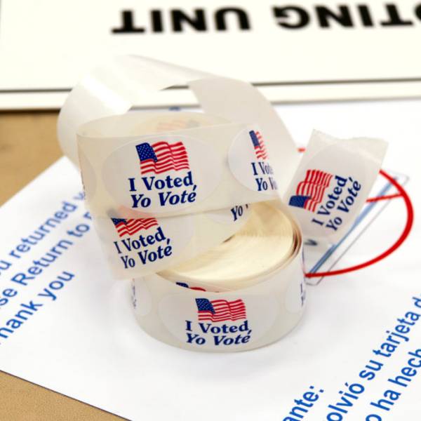 Voting materials and stickers. Image via Wikimedia Commons (CCA-BY-2.0)